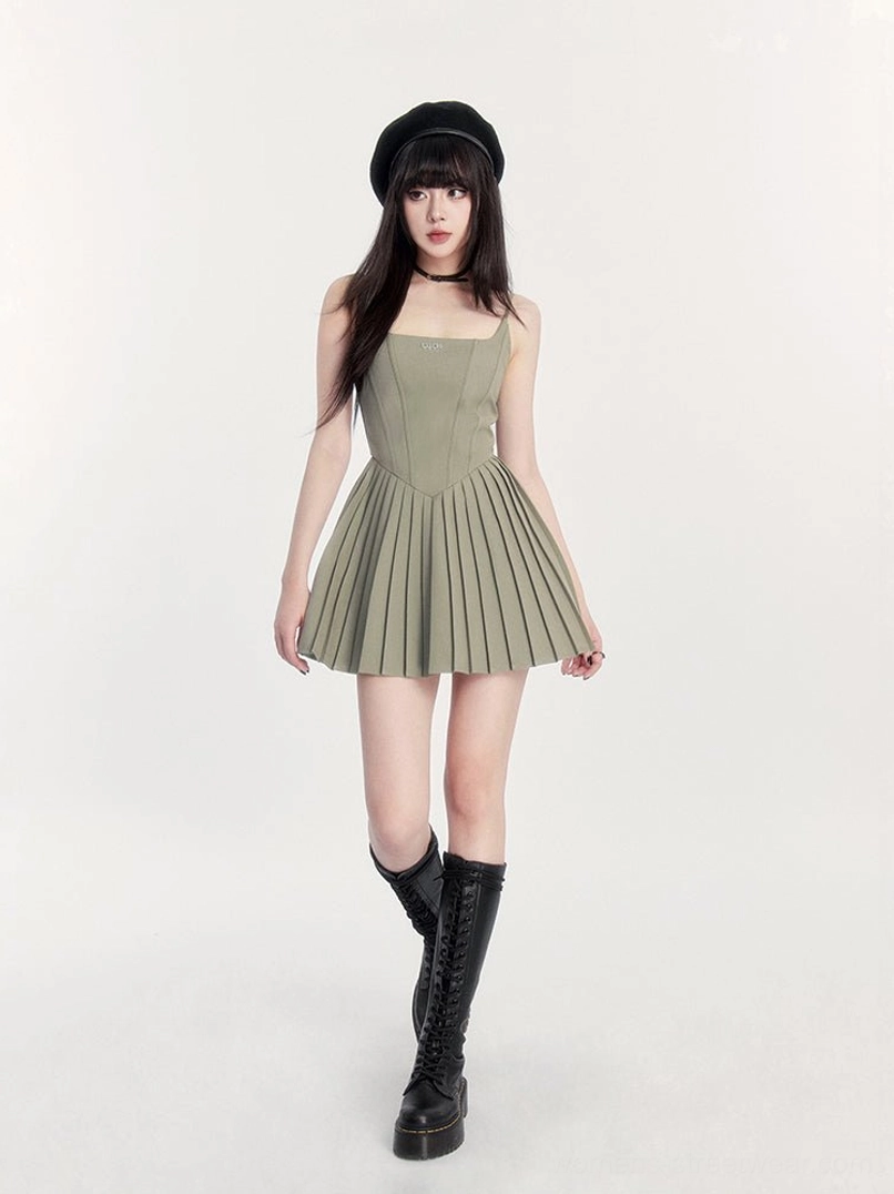 Sage green pleated cami mini dress styled with black beret and platform combat boots in alternative streetwear fashion