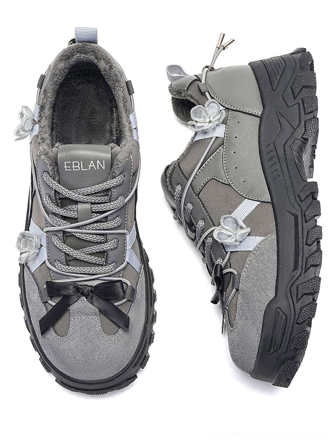 Sakura plush chunky trail sneakers detailed product view highlighting the layered technical upper floral appliques reflective streetwear finish and rugged outsole