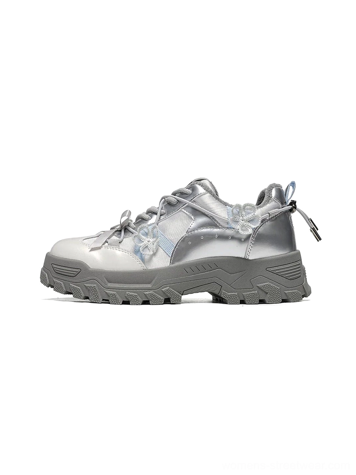 Silver sakura plush chunky trail sneaker in side three quarter view with metallic upper floral lace accents reflective panels rugged lug sole and rear pull tab