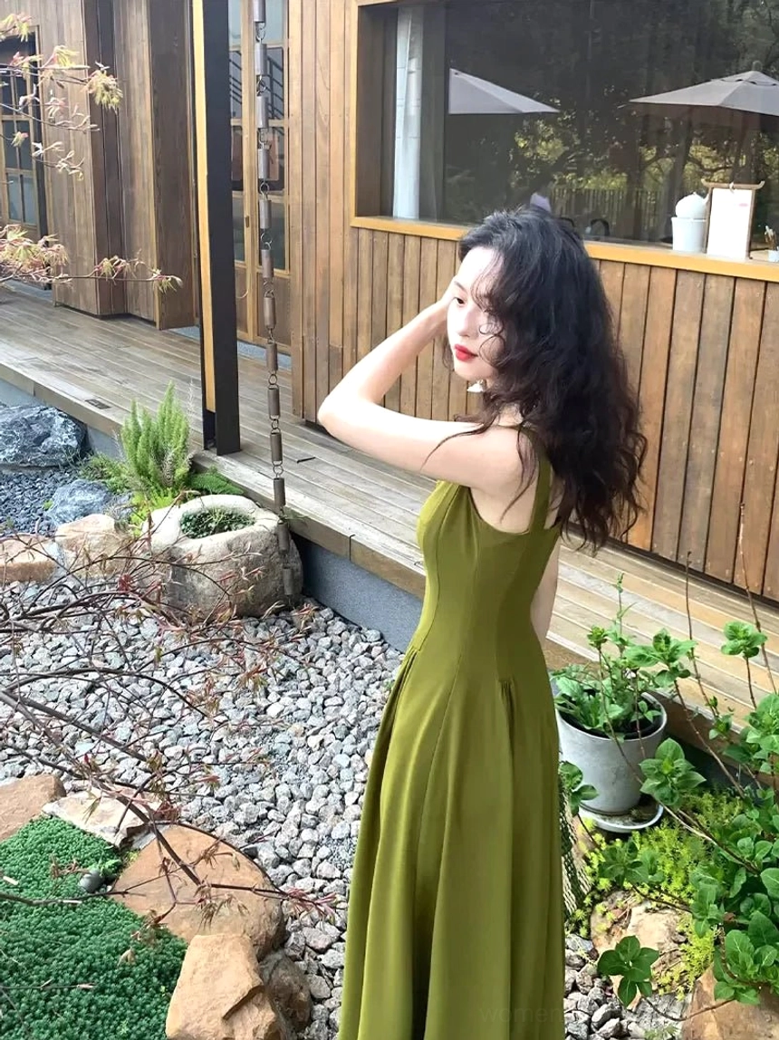 Side view of a Salted Vegetable Green olive green square neck sleeveless maxi dress with wide straps, tailored waist, and ankle length hem