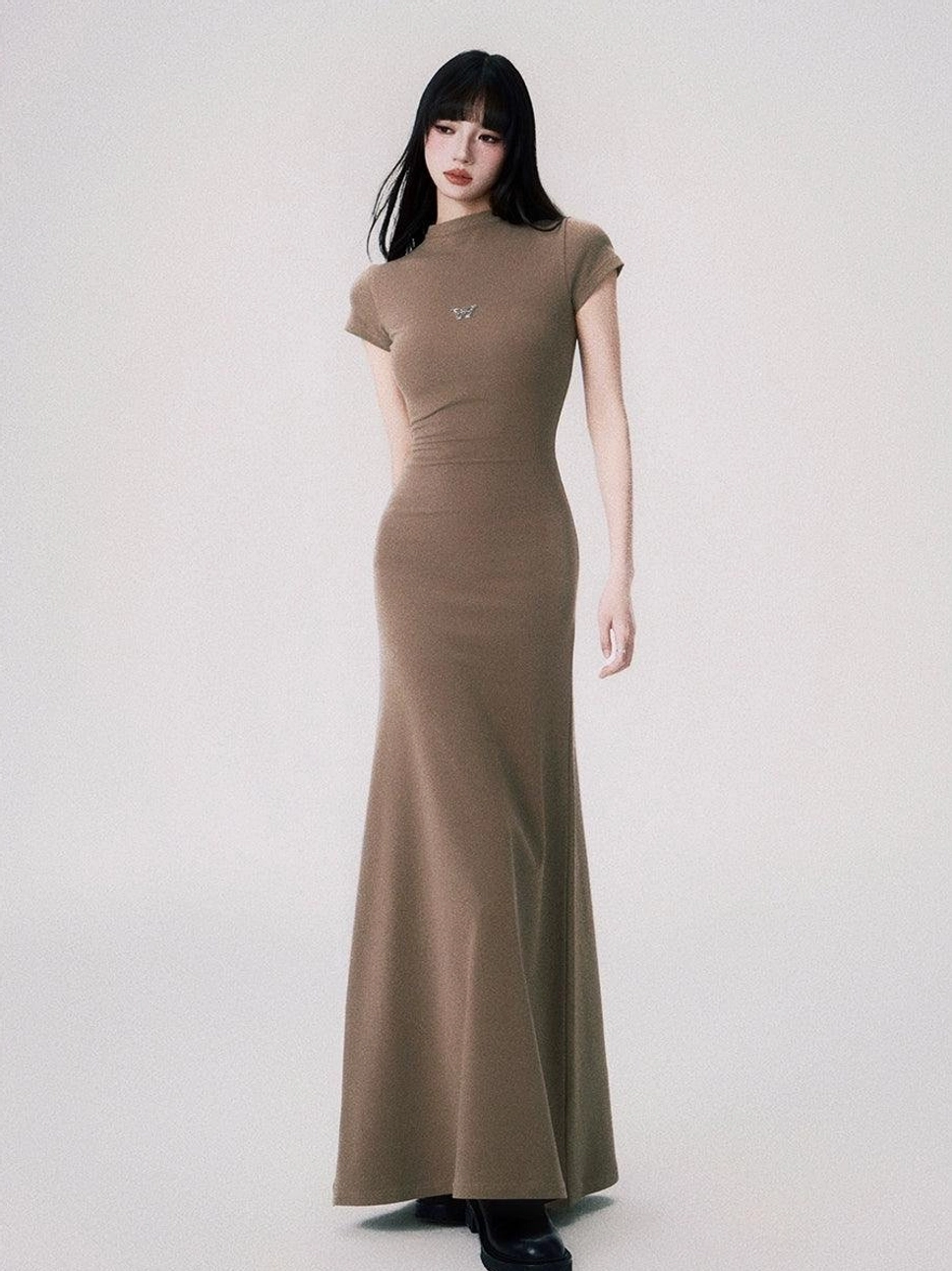 Sand butterfly emblem fitted maxi dress variation with bodycon shape mock neck and floor length fishtail hem