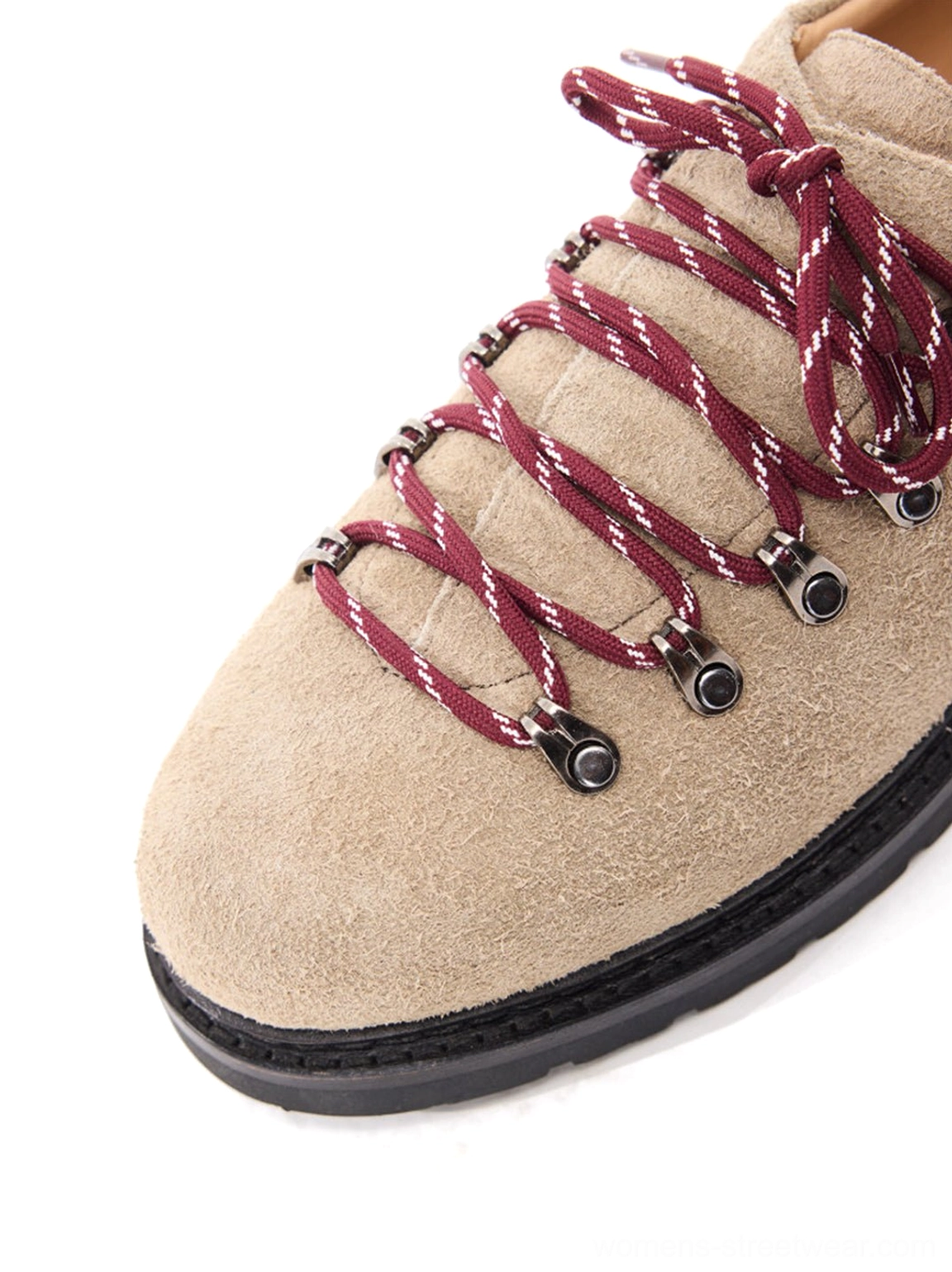 Close-up of sand nubuck suede derby shoe toe box with metal lace hooks and burgundy hiking laces