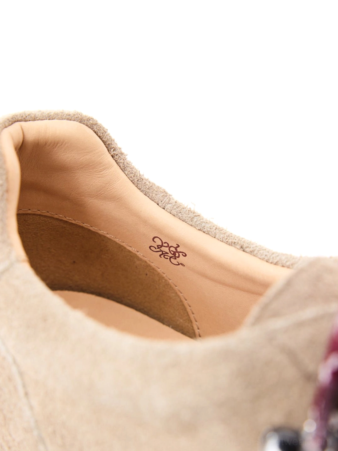Interior view of sand suede hiking derby shoe with soft collar and tan leather-lined insole detail