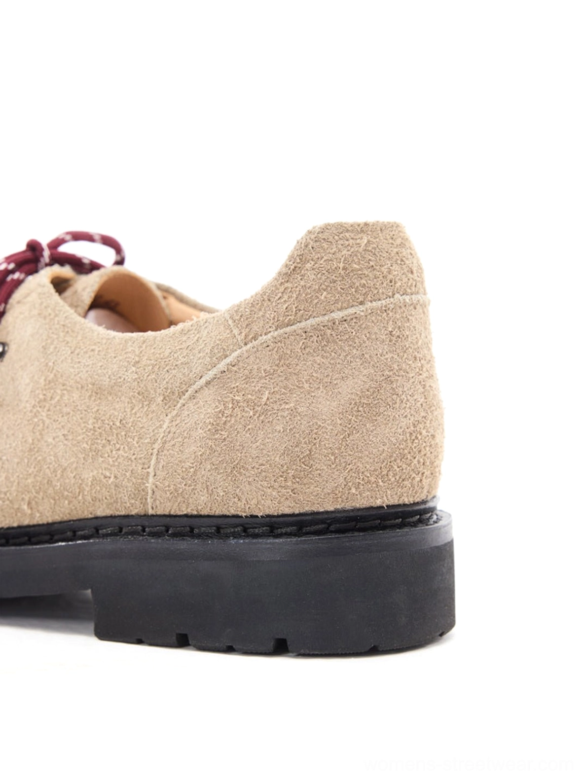 Rear side profile of sand suede hiking-lace derby shoe showing stitched midsole and suede heel counter