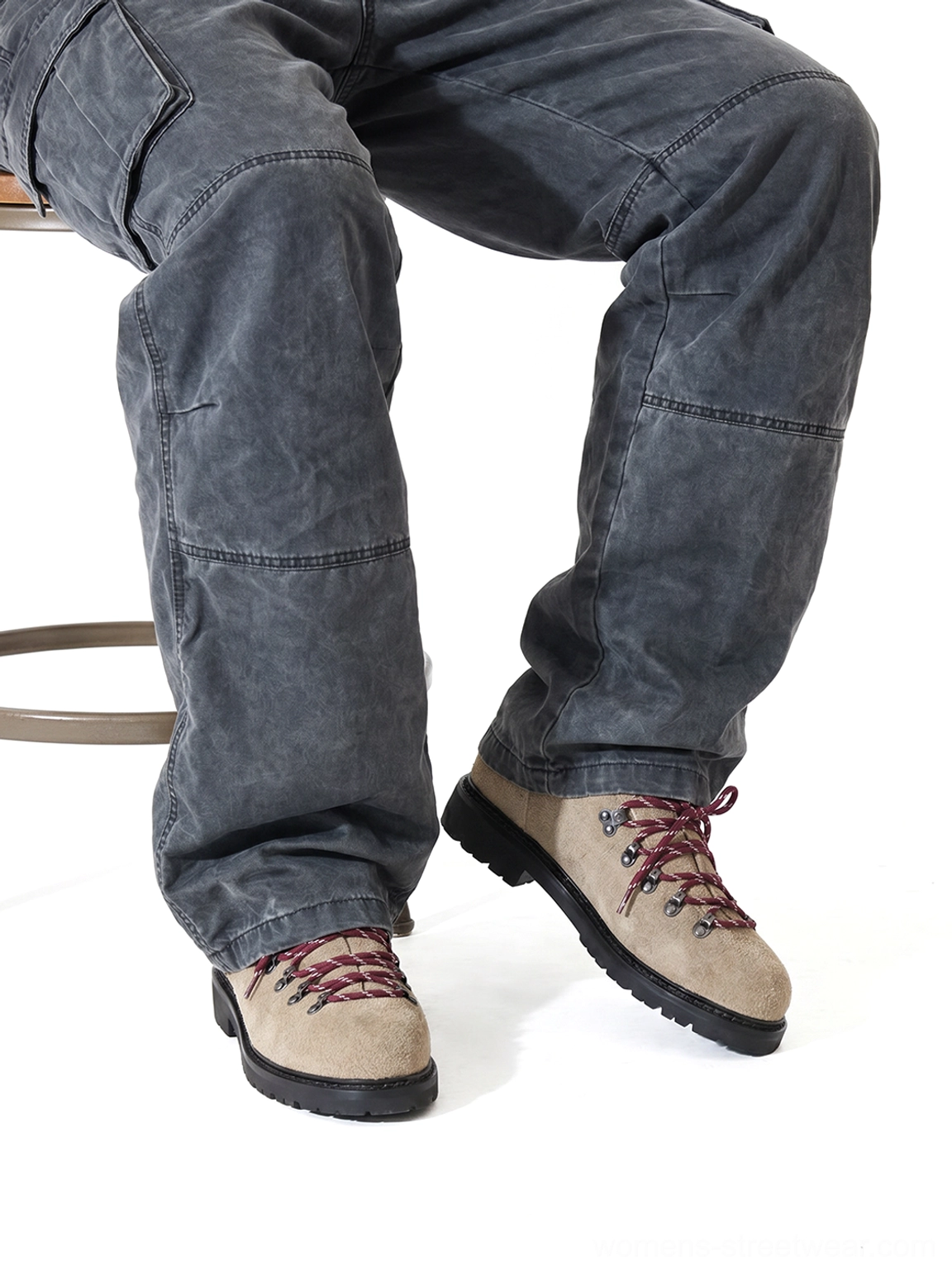 Sand suede hiking-lace derby shoes styled with dark grey cargo pants in seated streetwear outfit view