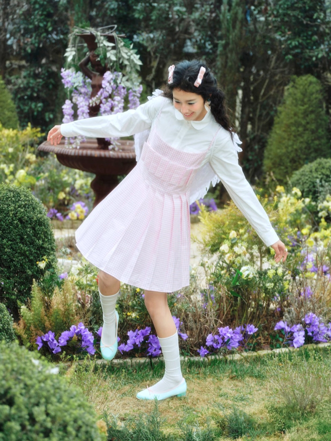 Three-quarter outfit view of light blue satin bow ballet pumps styled for romantic Seoul preppy fashion