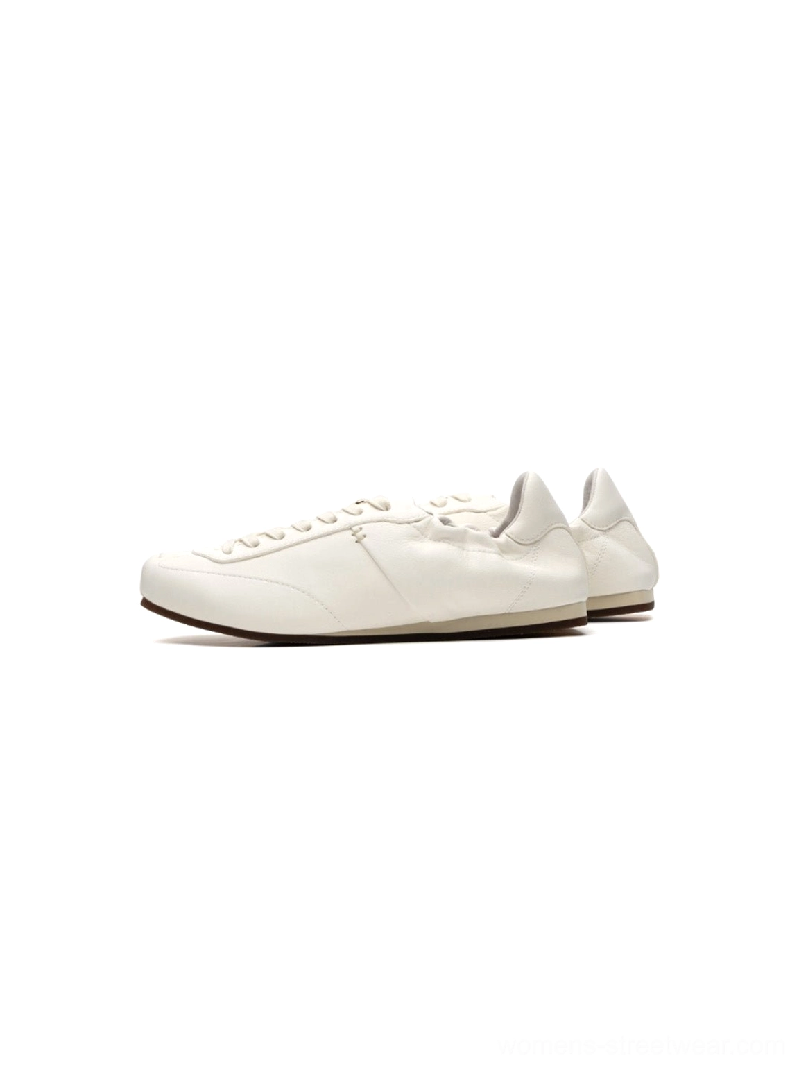 White women's low-profile retro trainers with a slim rounded silhouette and minimalist ribbon lace-up streetwear design