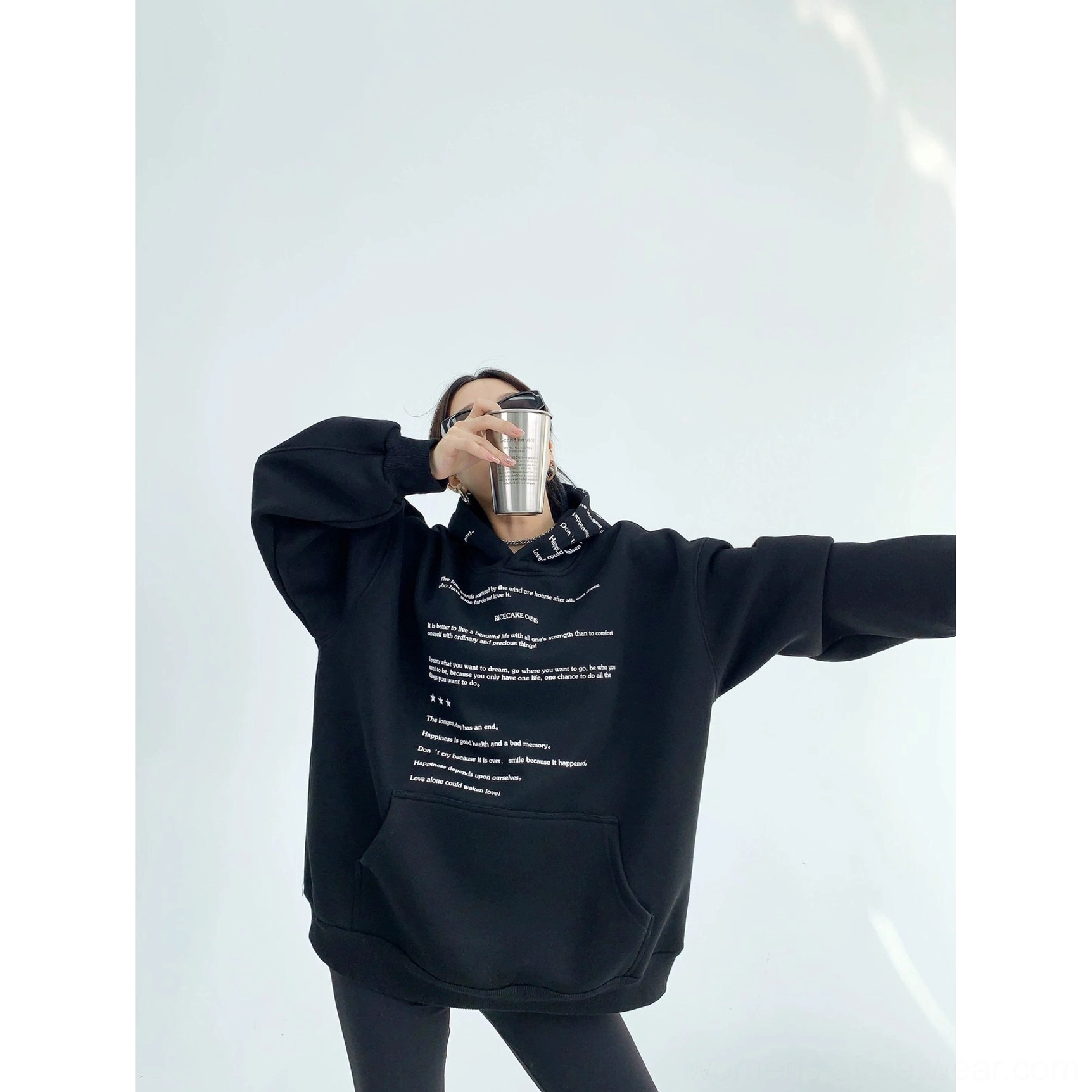 Black oversized script print drop shoulder fleece hoodie three quarter front view in Korean streetwear styling