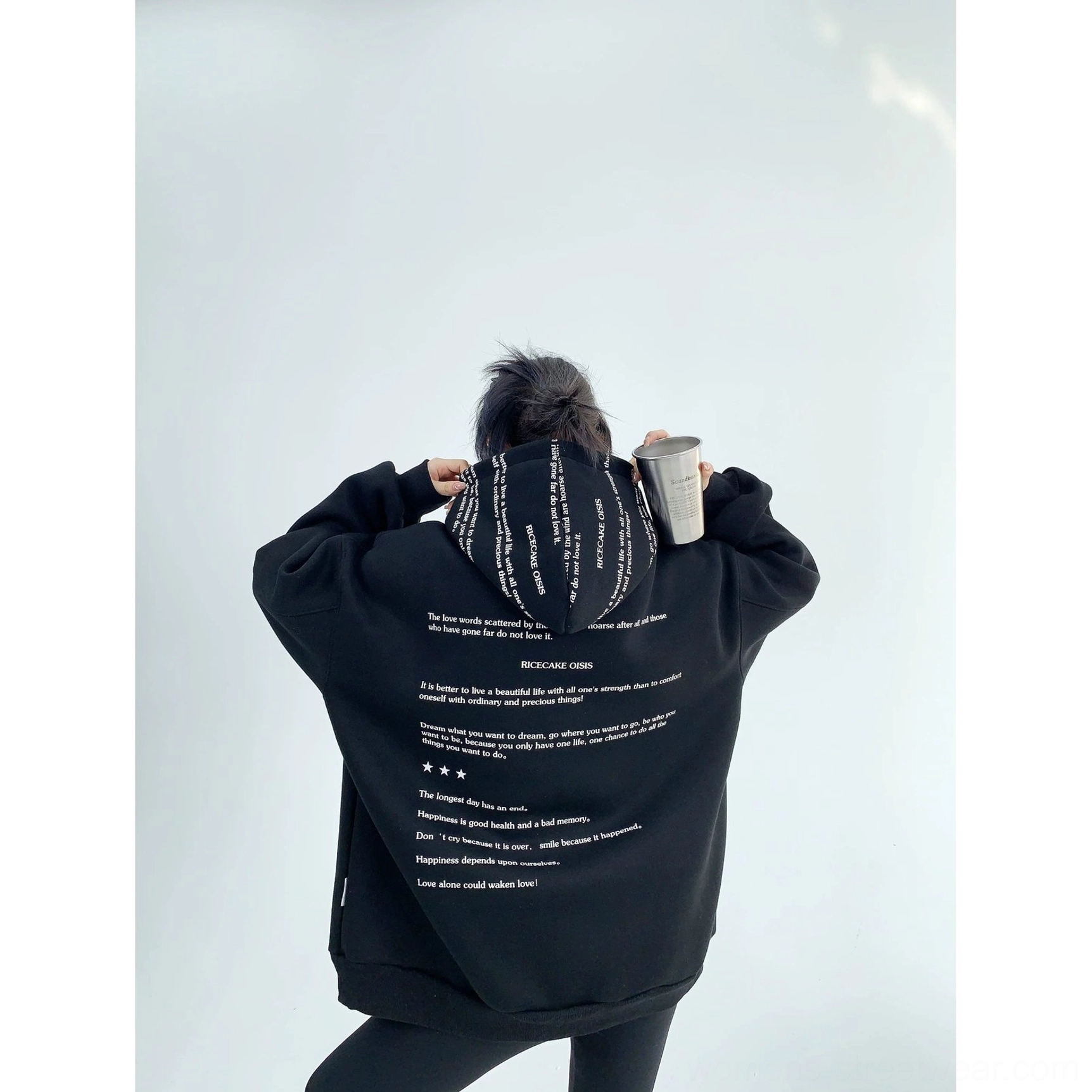 Black oversized graphic fleece hoodie back view with full white script typography and printed hood detail