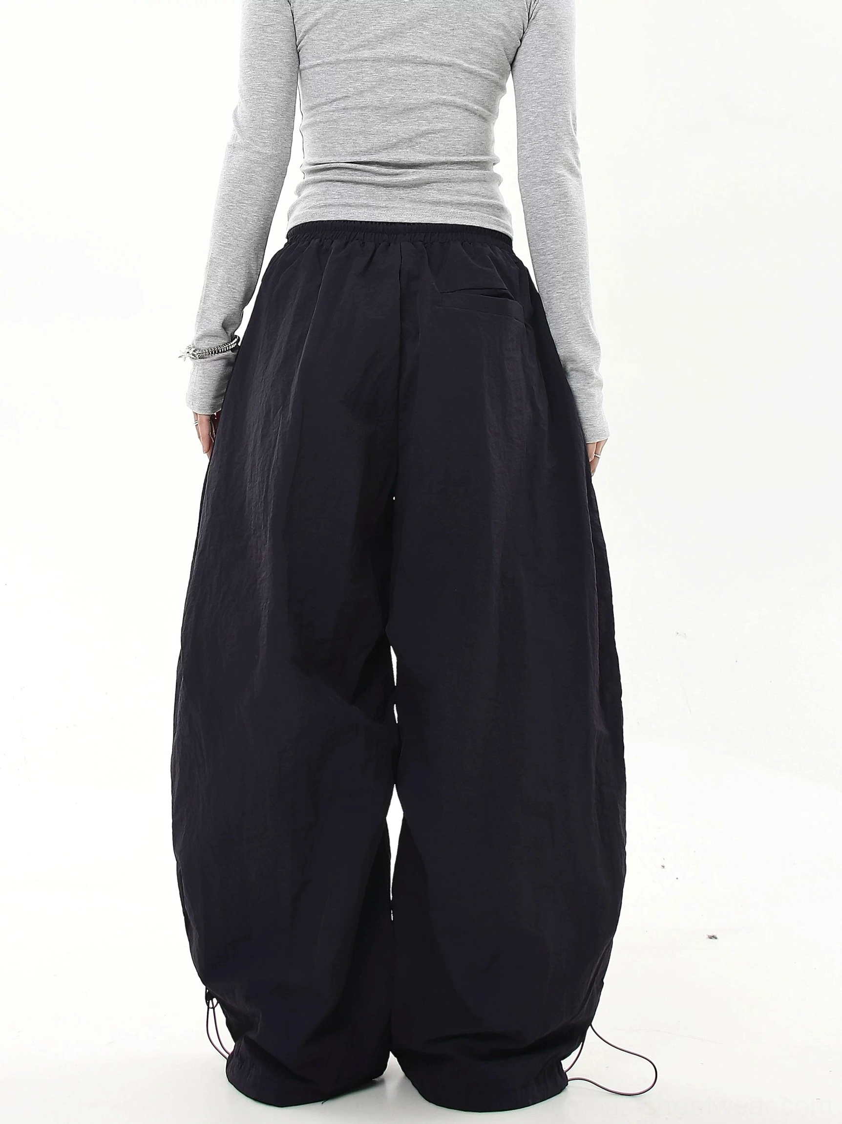 Scripted Devotion oversized parachute streetwear cargo pants with wide-leg styling, adjustable drawcord details and expressive embroidered lettering