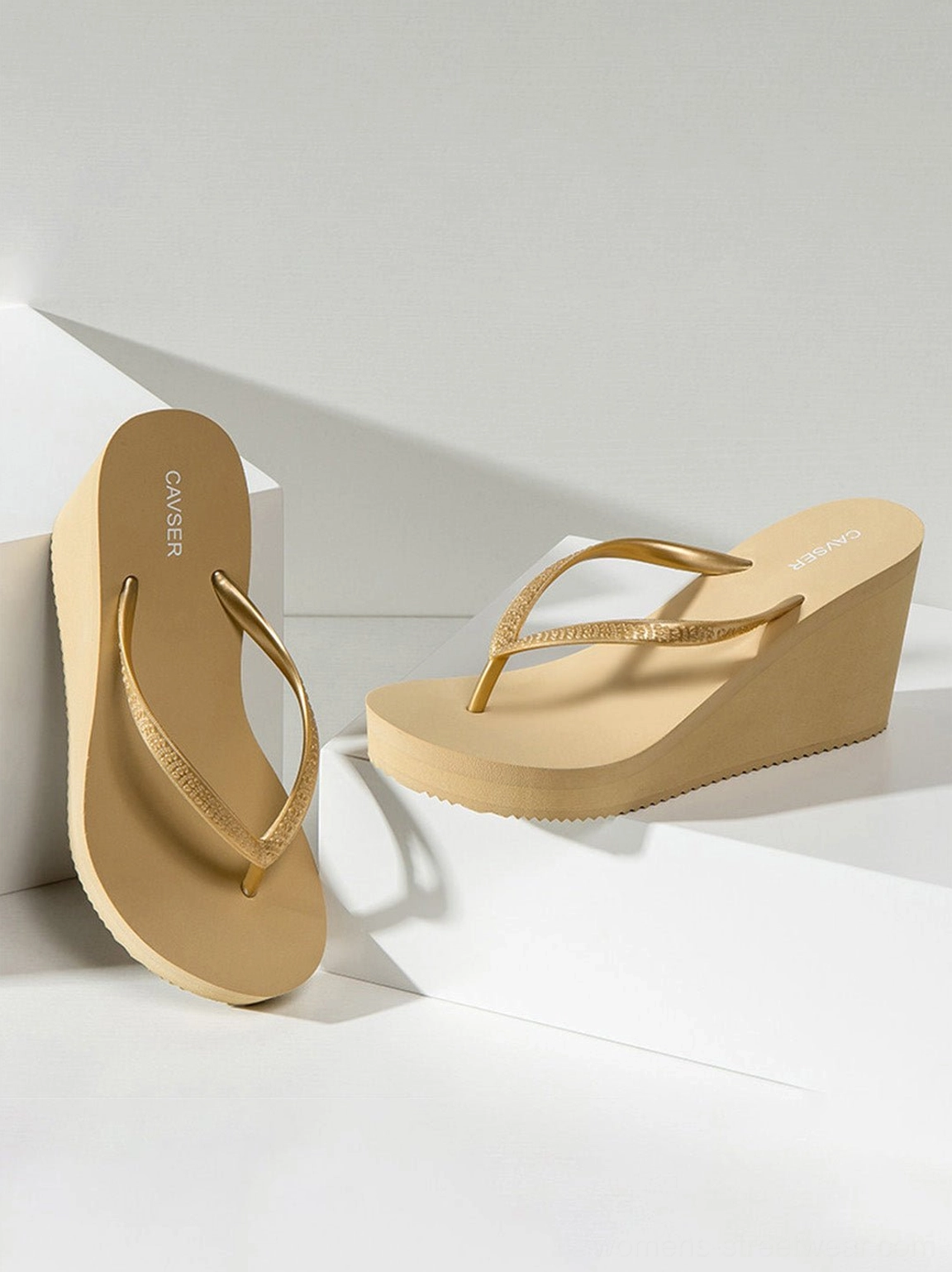 Sculpted platform flip-flops with glitter toe-ring straps for Y2K and resort-inspired styling