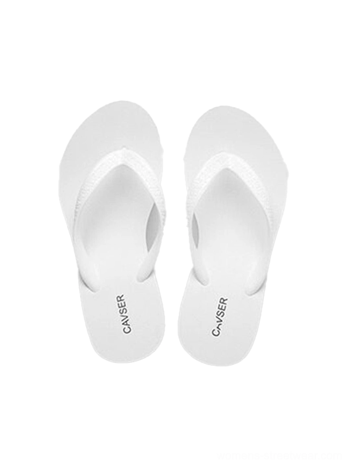 Sculpted platform wedge toe-ring flip-flops shown in a close-up of the strap and footbed