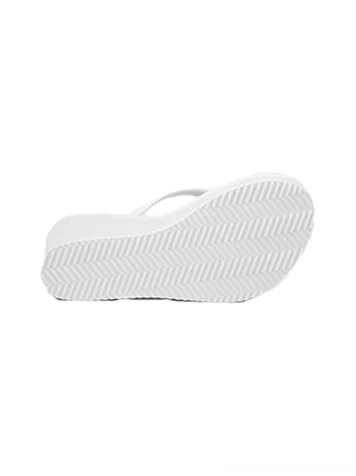 Sculpted wedge toe-ring flip-flops showing a modern Y2K-inspired platform sandal silhouette