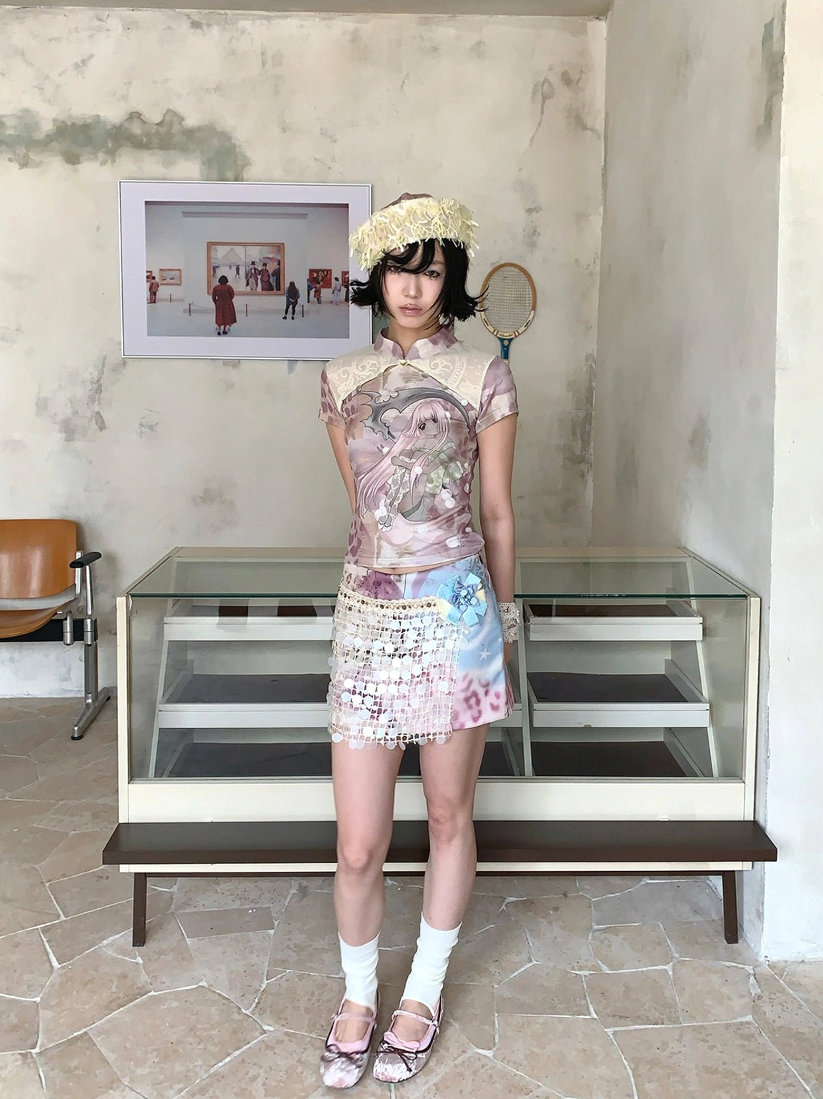 Full-body Seoul-inspired streetwear outfit with a cheongsam collar anime tee, tie-dye beaded skirt, white socks, and flat sandals