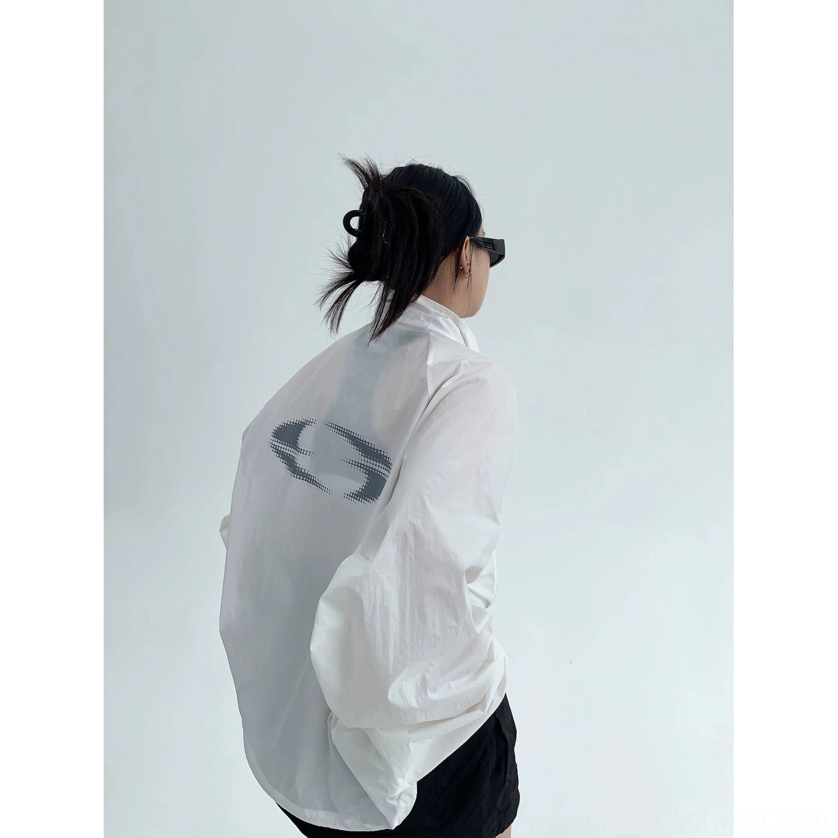 Seoul-inspired oversized windbreaker jacket product image with clean minimalist styling, lightweight woven polyester, practical zipper, and casual urban fit