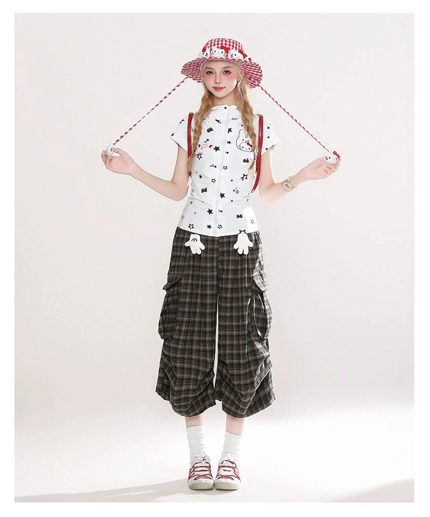 Full body Seoul street style outfit featuring brown plaid cargo culotte shorts, checkered bucket hat, graphic tee, white socks, and red sneakers