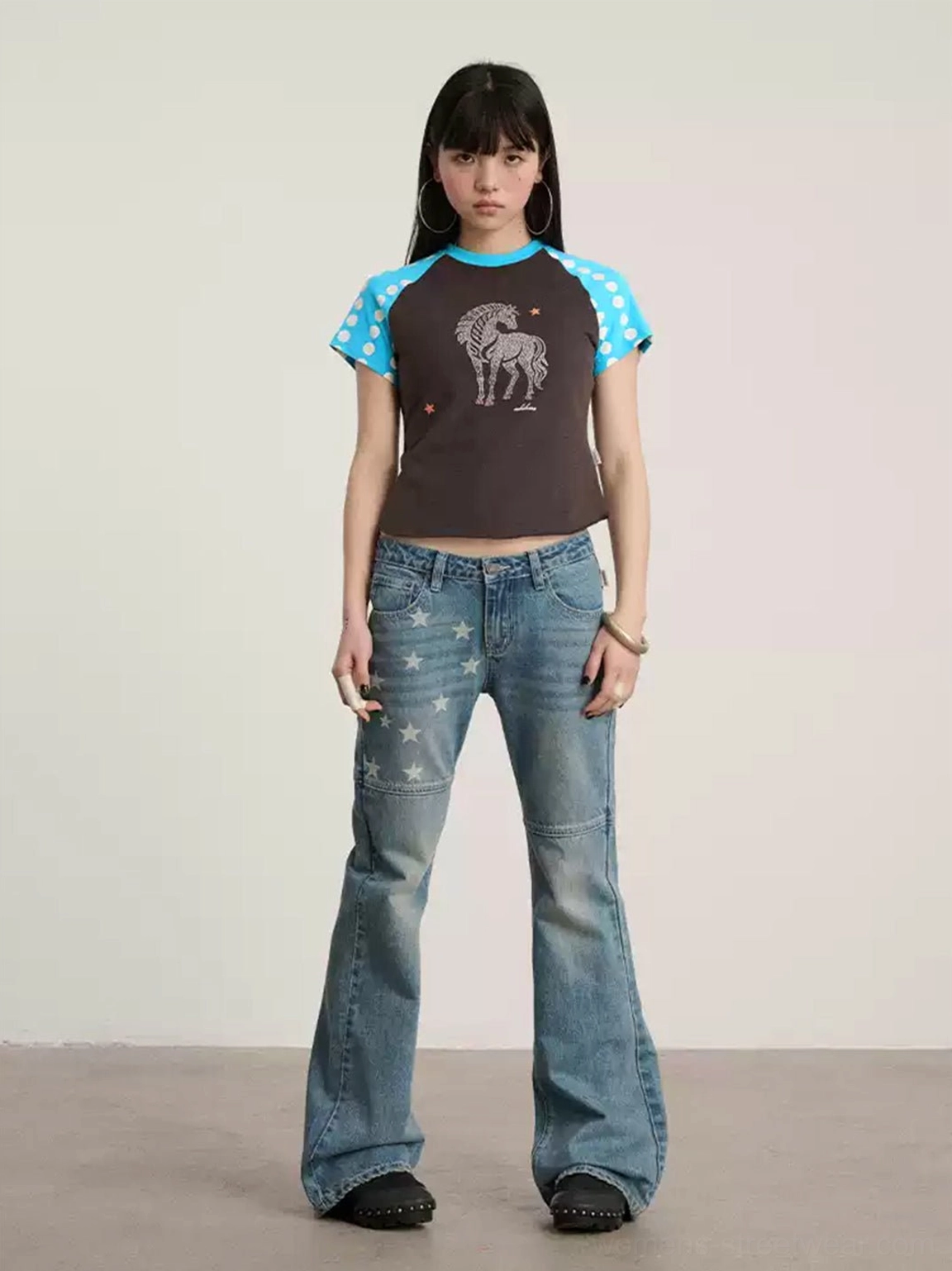 Seoul street style inspired star panel flare jeans in faded blue denim with low-rise fit, fitted thighs, and flared legs