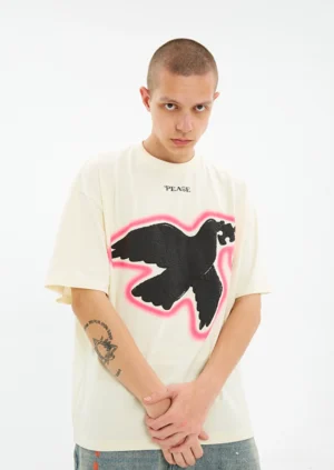 Male model wearing the Serene Dove off white oversized suede foam print T-shirt in a close front view