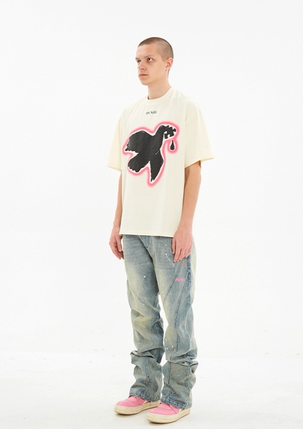 Three quarter front view of the off white Serene Dove oversized peace graphic T-shirt with raised foam print