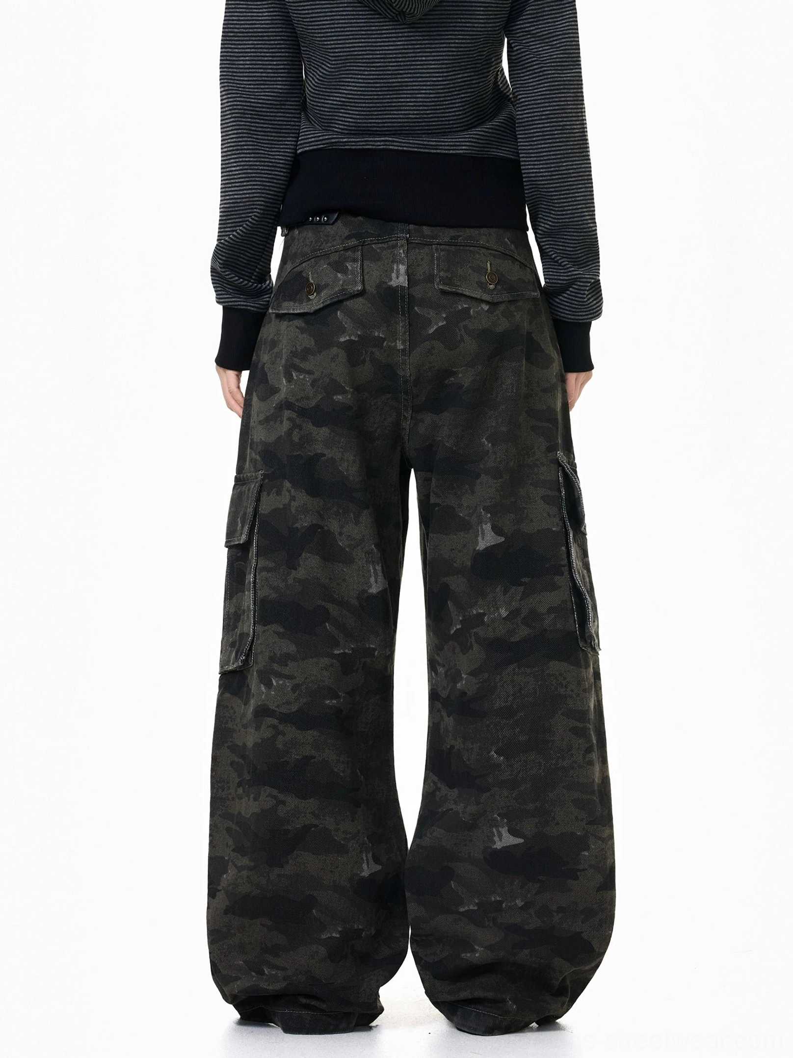 Rear view of dark washed camouflage wide-leg cargo pants showing loose baggy fit, back patch pockets, and streetwear silhouette