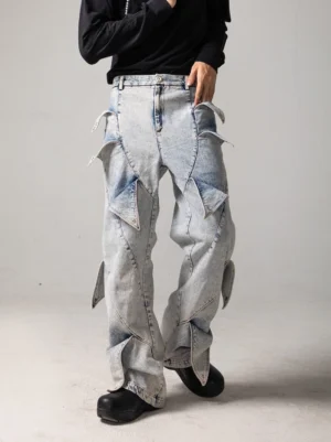 Front view of light blue acid wash shark fin panel baggy jeans with wide legs and sculpted streetwear denim details