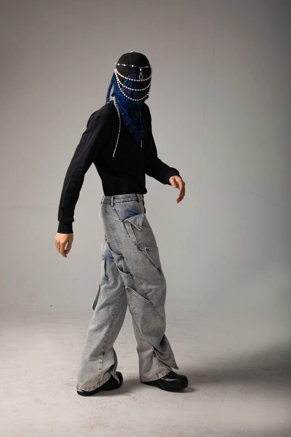 Full body styling view of shark fin panel wide leg jeans with layered denim details and Y2K streetwear attitude