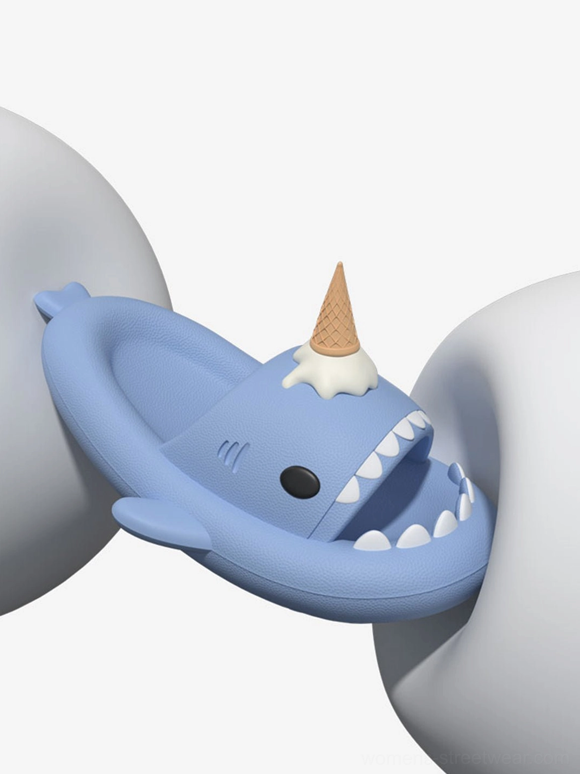 Close-up of light blue shark platform slipper with white shark teeth, ice cream charm, and thick EVA platform sole