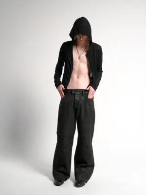 Sheer black cross script zip-up hoodie worn open by male model with matching streetwear track pants front view