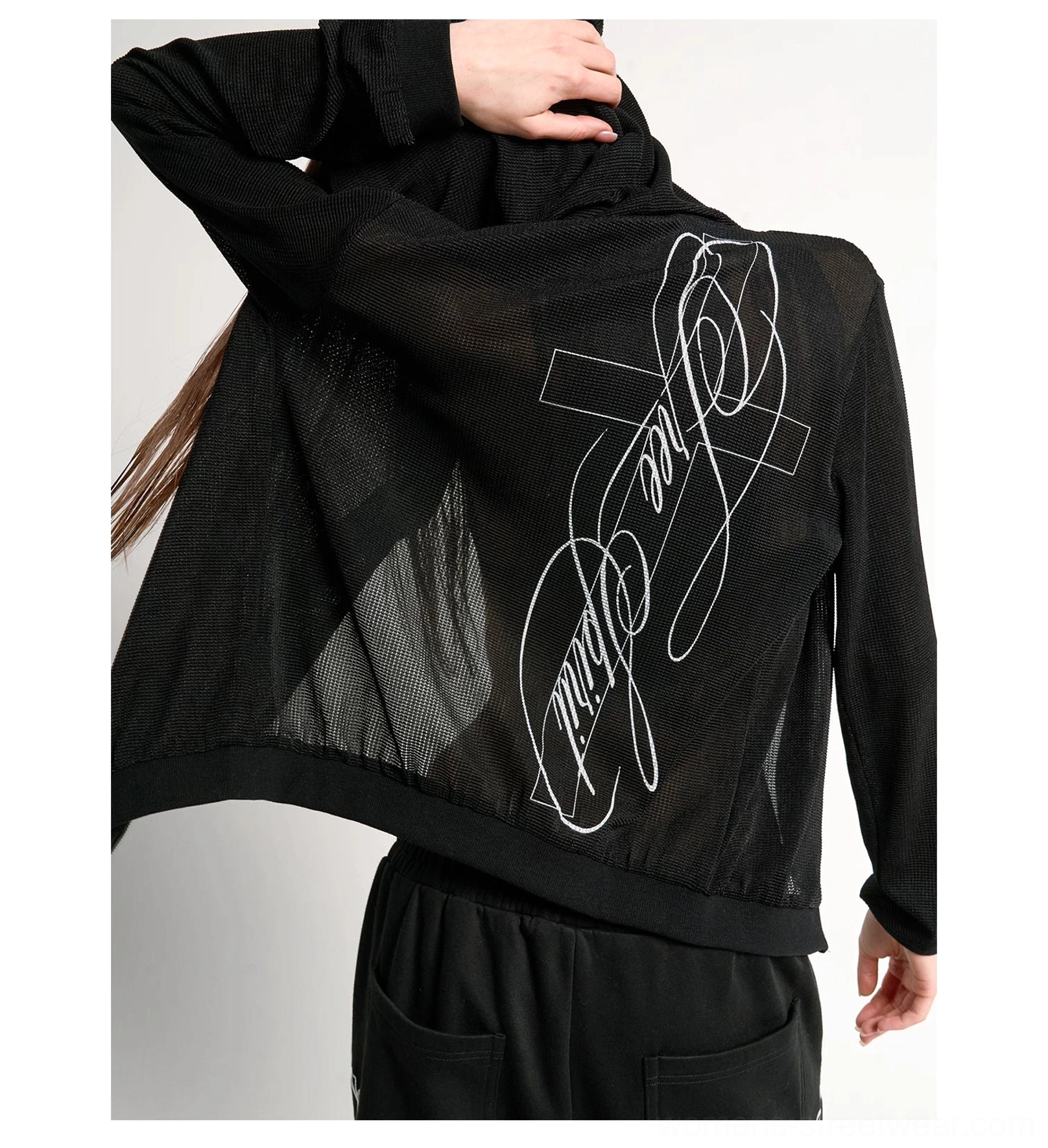 Semi-transparent black waffle knit hoodie rear side view showing white cursive cross script back graphic detail