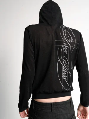 Black semi-sheer waffle knit zip-up hoodie back view featuring oversized white cross and cursive script graphic