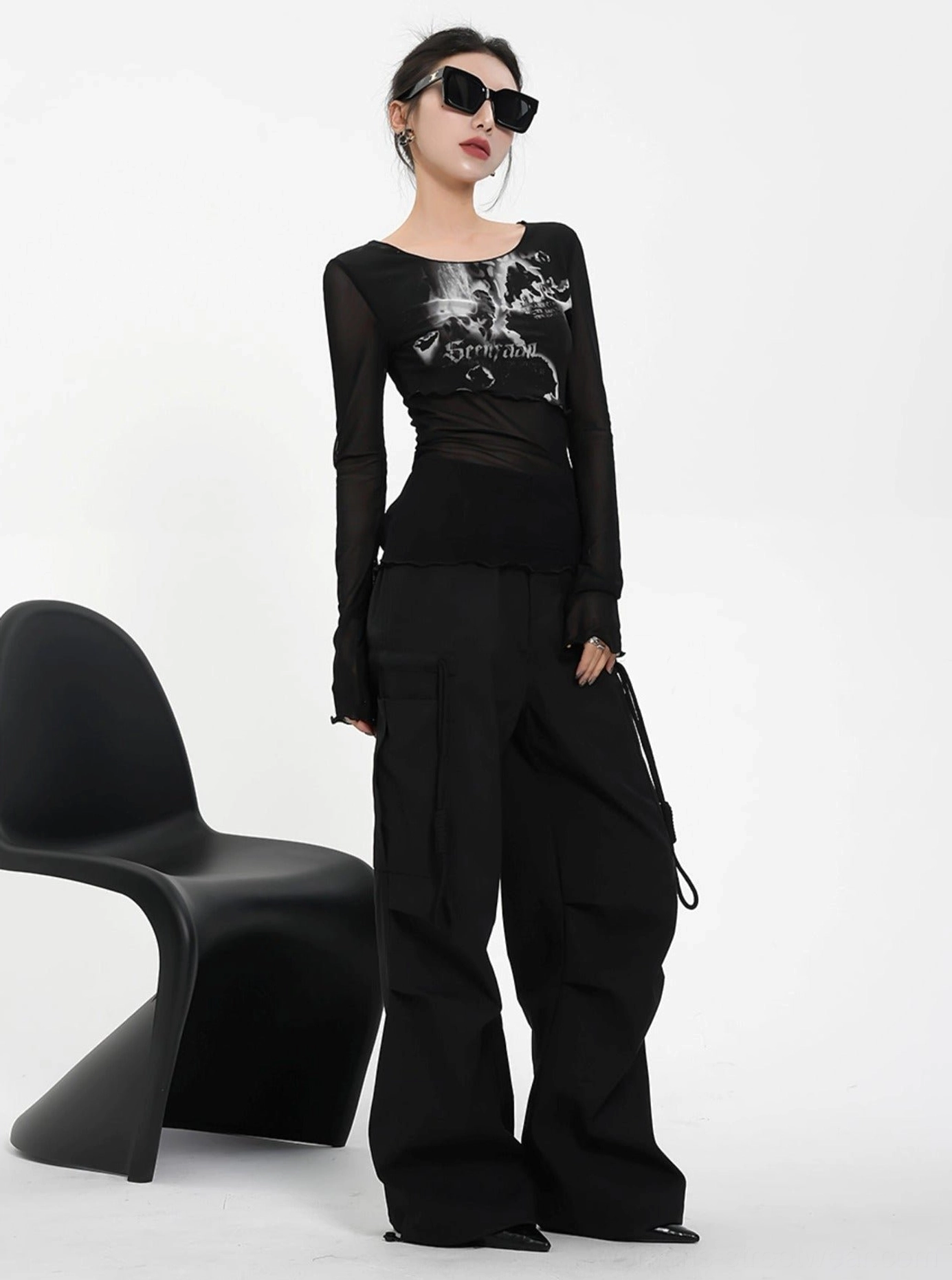 Sheer floral graphic cropped long sleeve top featuring romantic print and contemporary avant-garde styling
