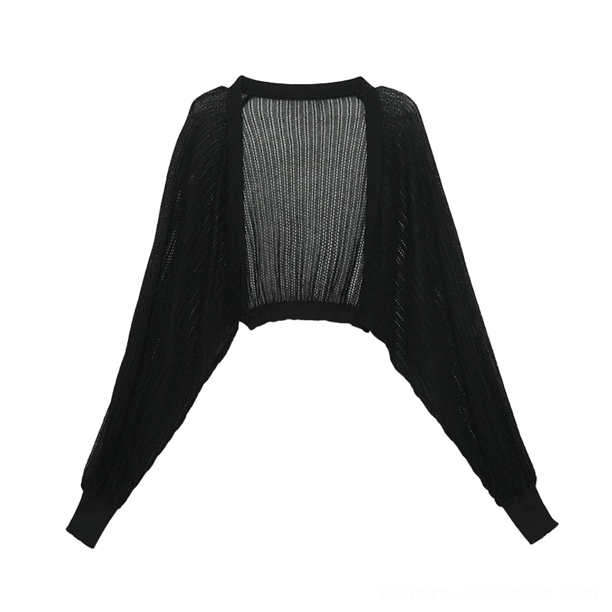 Black sheer knit batwing shrug cardigan with ribbed cuffs and open-front cropped fit