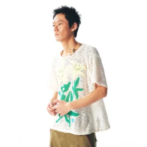 White sheer lily distressed layering tee worn by male model in three-quarter studio portrait
