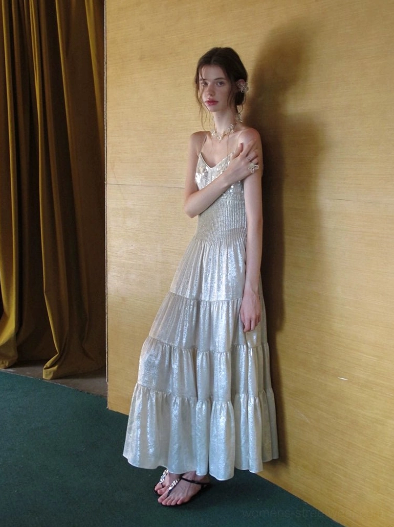 Champagne spaghetti strap tiered maxi dress with ruched bodice and luminous flowing layered skirt side view