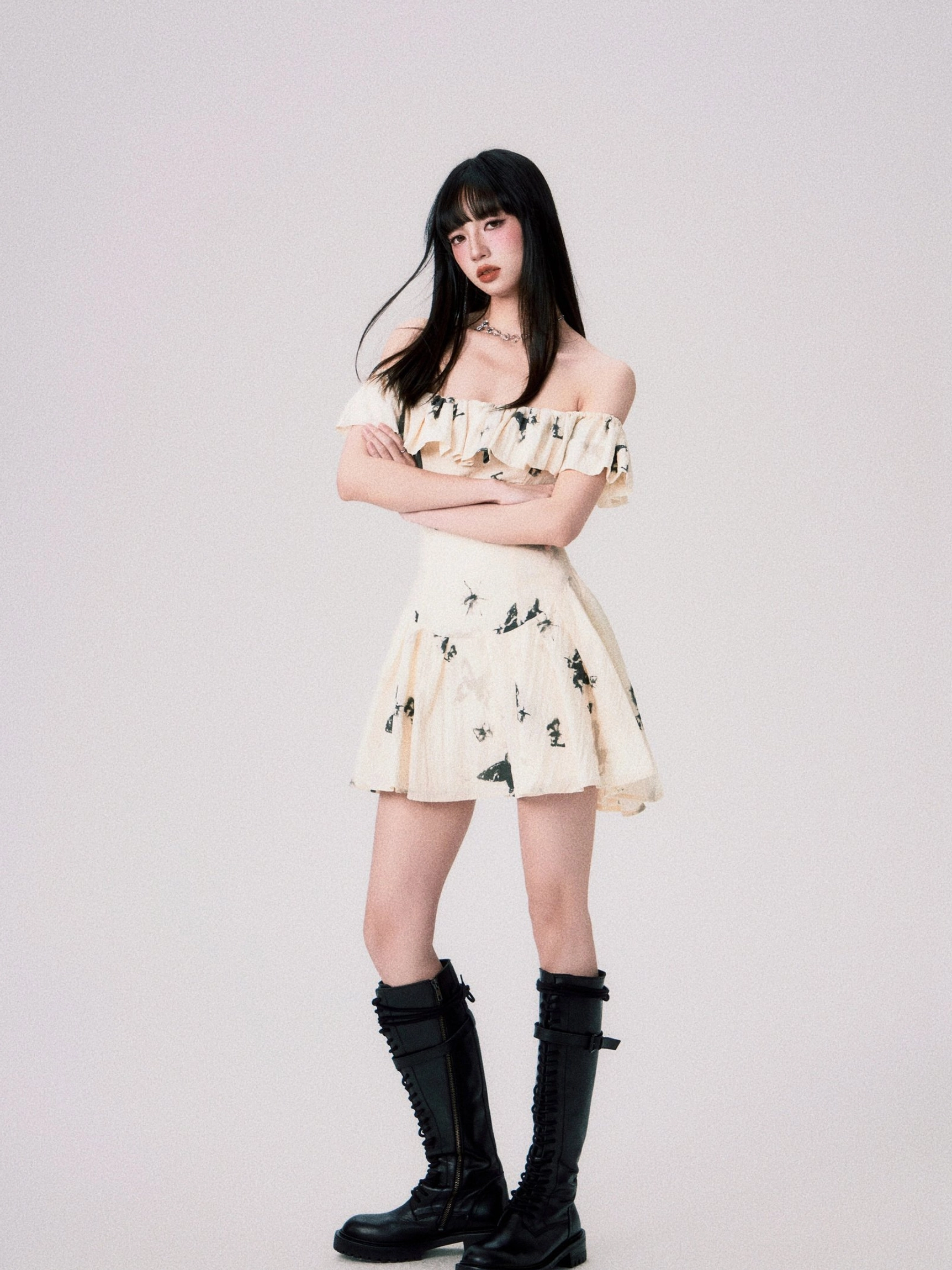 Short ink butterfly off-shoulder ruffle dress playful mini silhouette view
