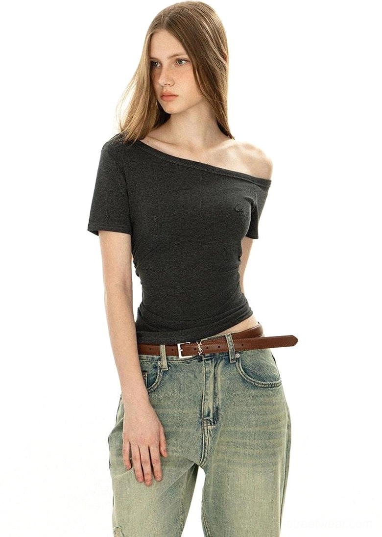 Side angle off-shoulder dark grey basic tee asymmetrical neckline detail short sleeves heathered fabric with vintage washed jeans