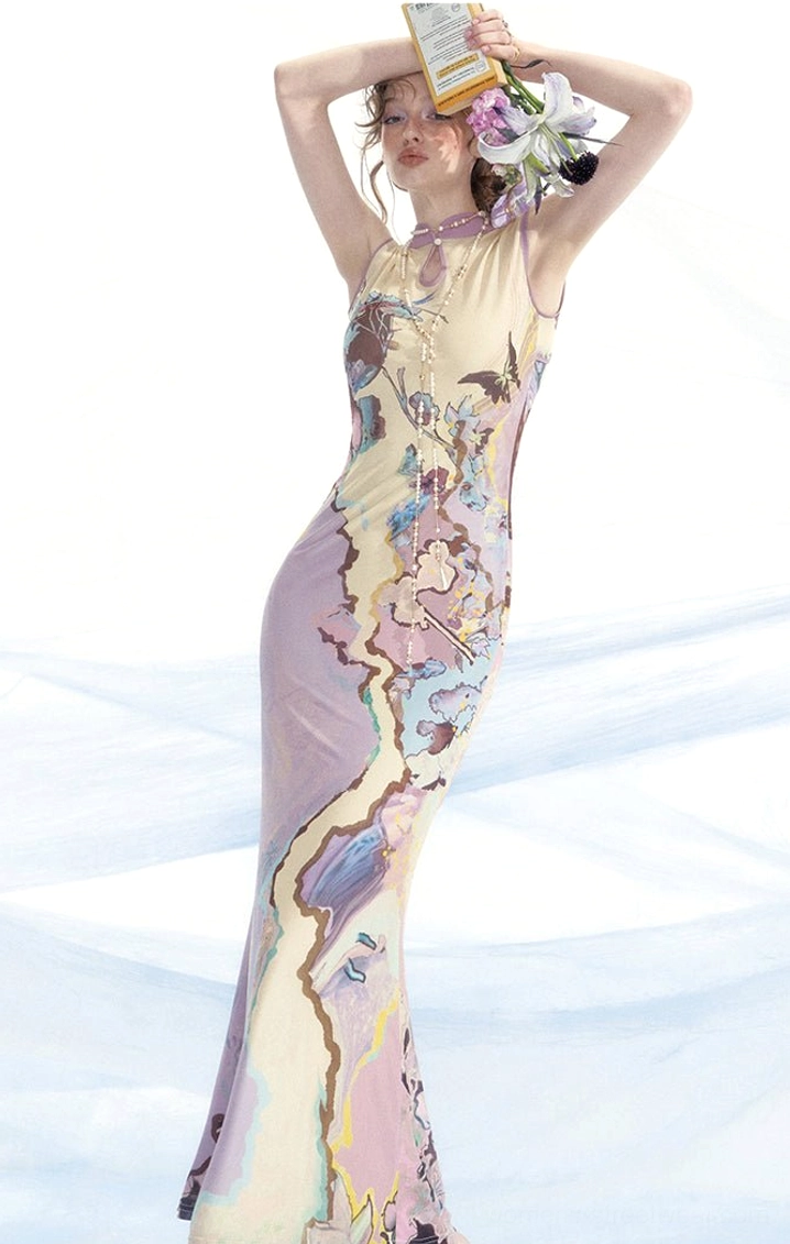 Side full body view of a sleeveless artistic watercolor print cheongsam dress with fitted fishtail hem and stand collar