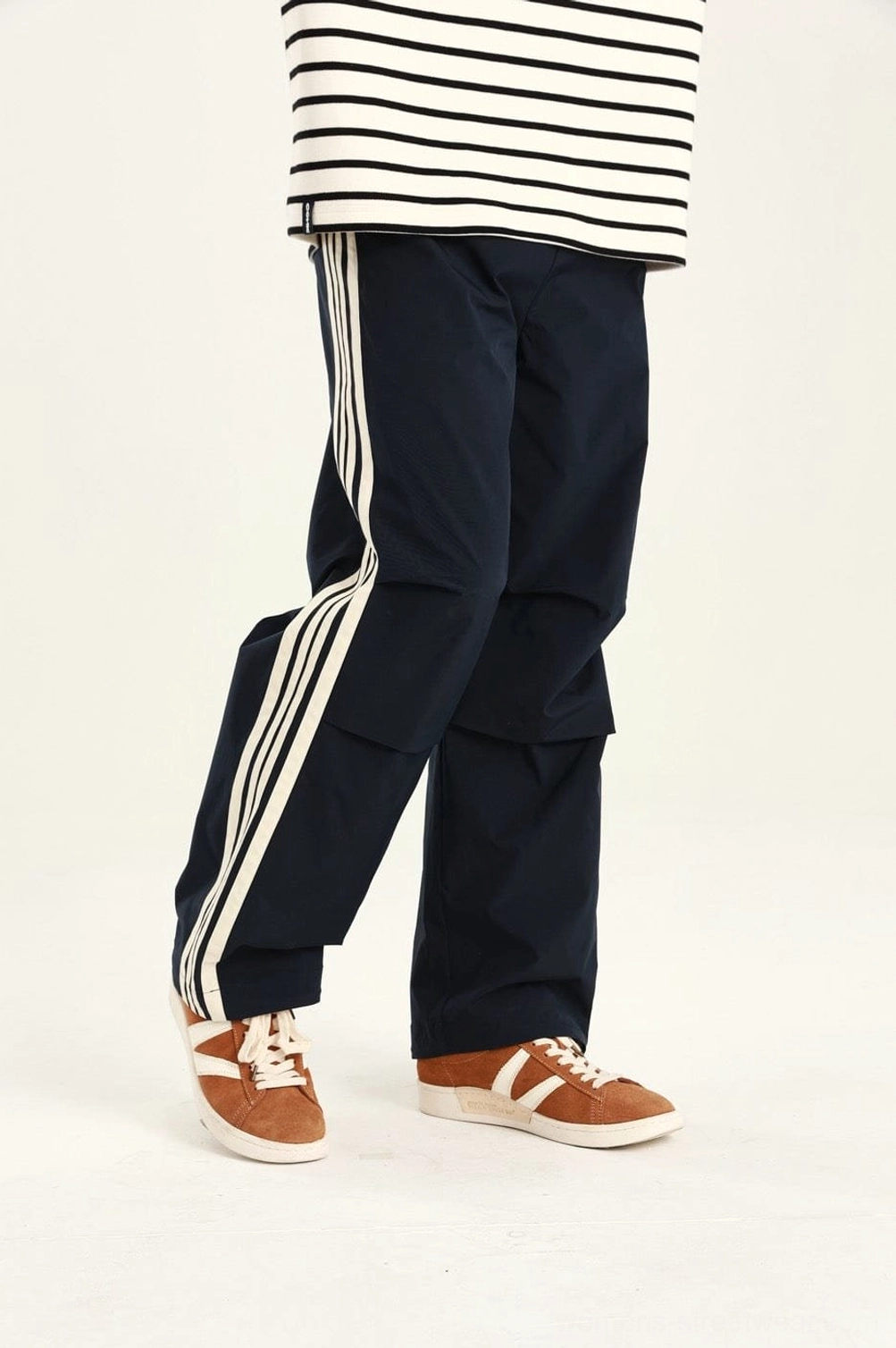 Contemporary streetwear pants with a straight-leg utility silhouette and athletic-inspired side detail