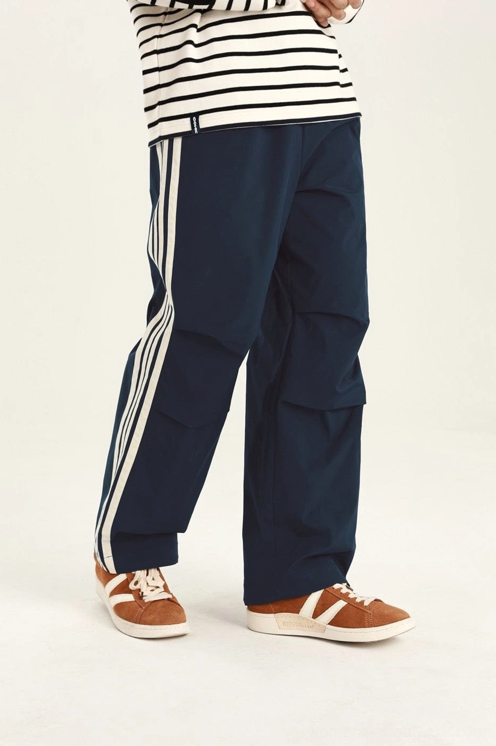 Urban streetwear cargo pants designed with relaxed proportions for Korean-inspired casual styling