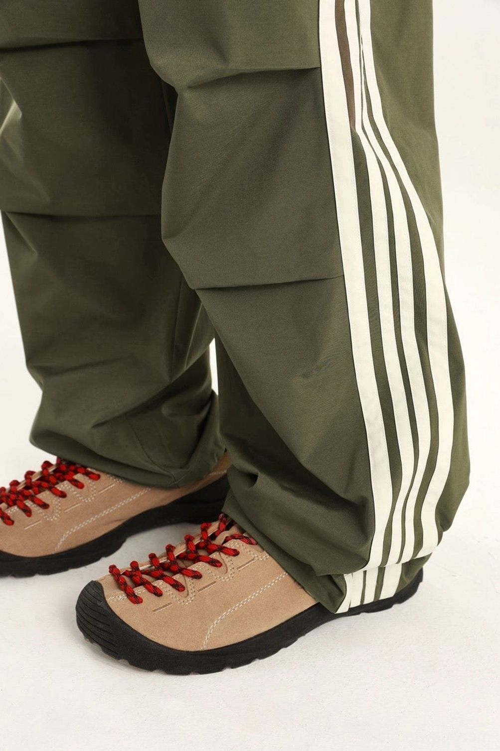 Modern urban cargo-style streetwear pants with relaxed proportions and athletic fashion influence