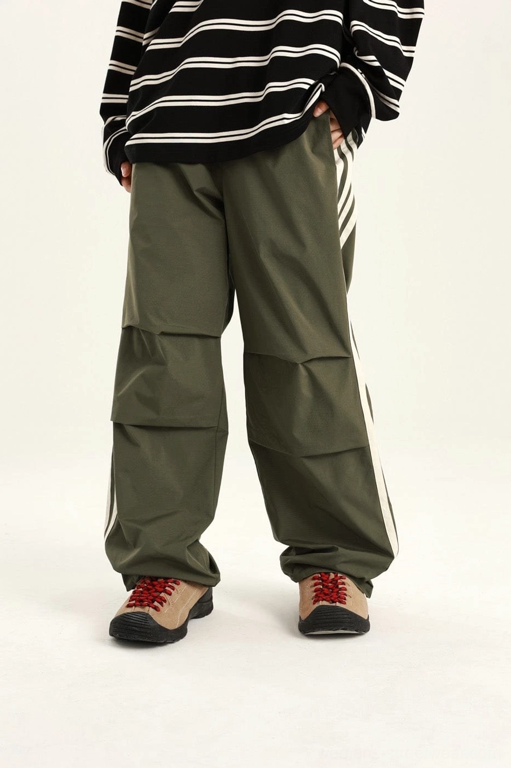 Relaxed streetwear cargo pants with sporty side-stripe styling for contemporary casual outfits