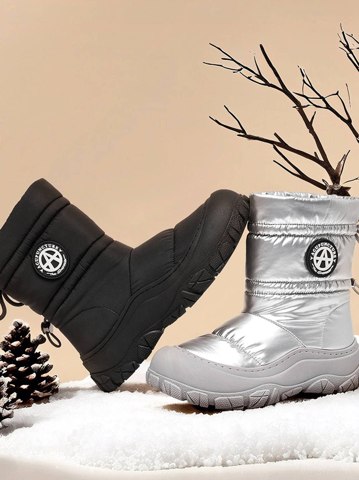 Silver and black puffer snow boot style with a technical mid-calf silhouette for streetwear winter looks