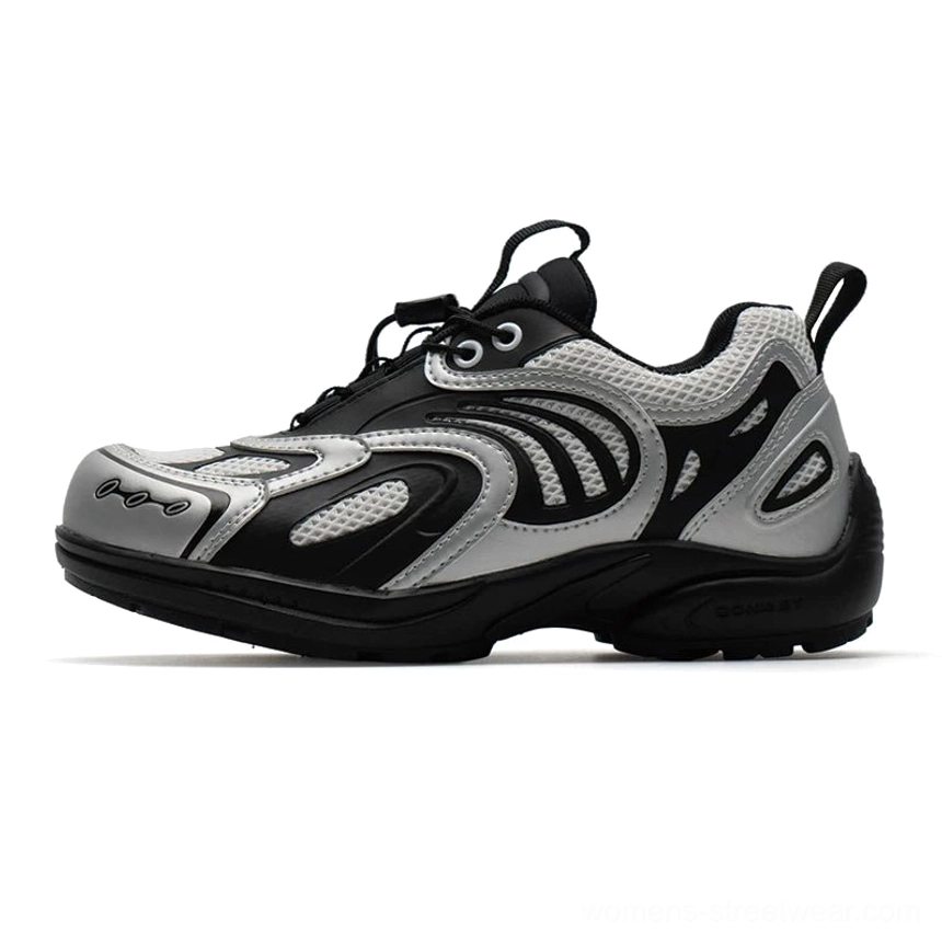 Silver black techwear mesh runner sneakers with metallic overlays bungee laces chunky rubber sole and heel pull tab on white background