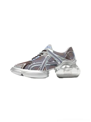 Silver-blue metallic mesh chunky runner sneakers shown in a side profile on a white studio background with sculpted silver sole and contrast stitching