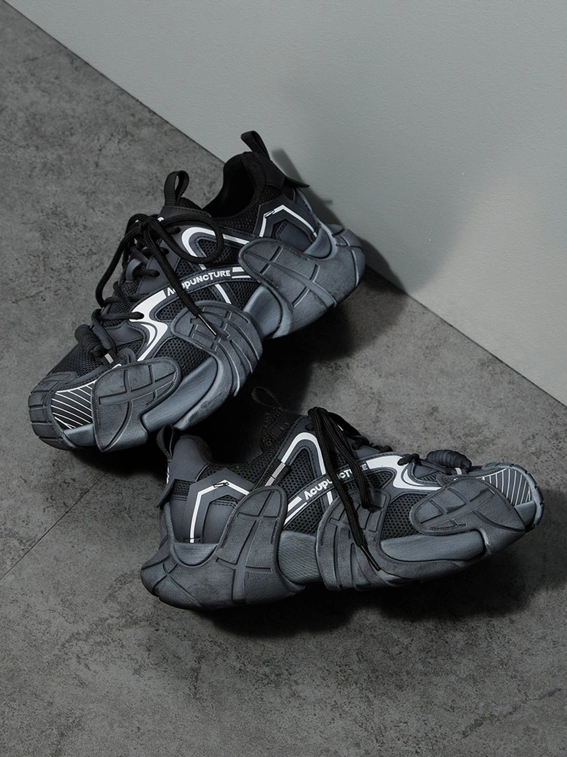 Silver cage panel chunky platform sneakers diagonal display showing layered metallic overlays