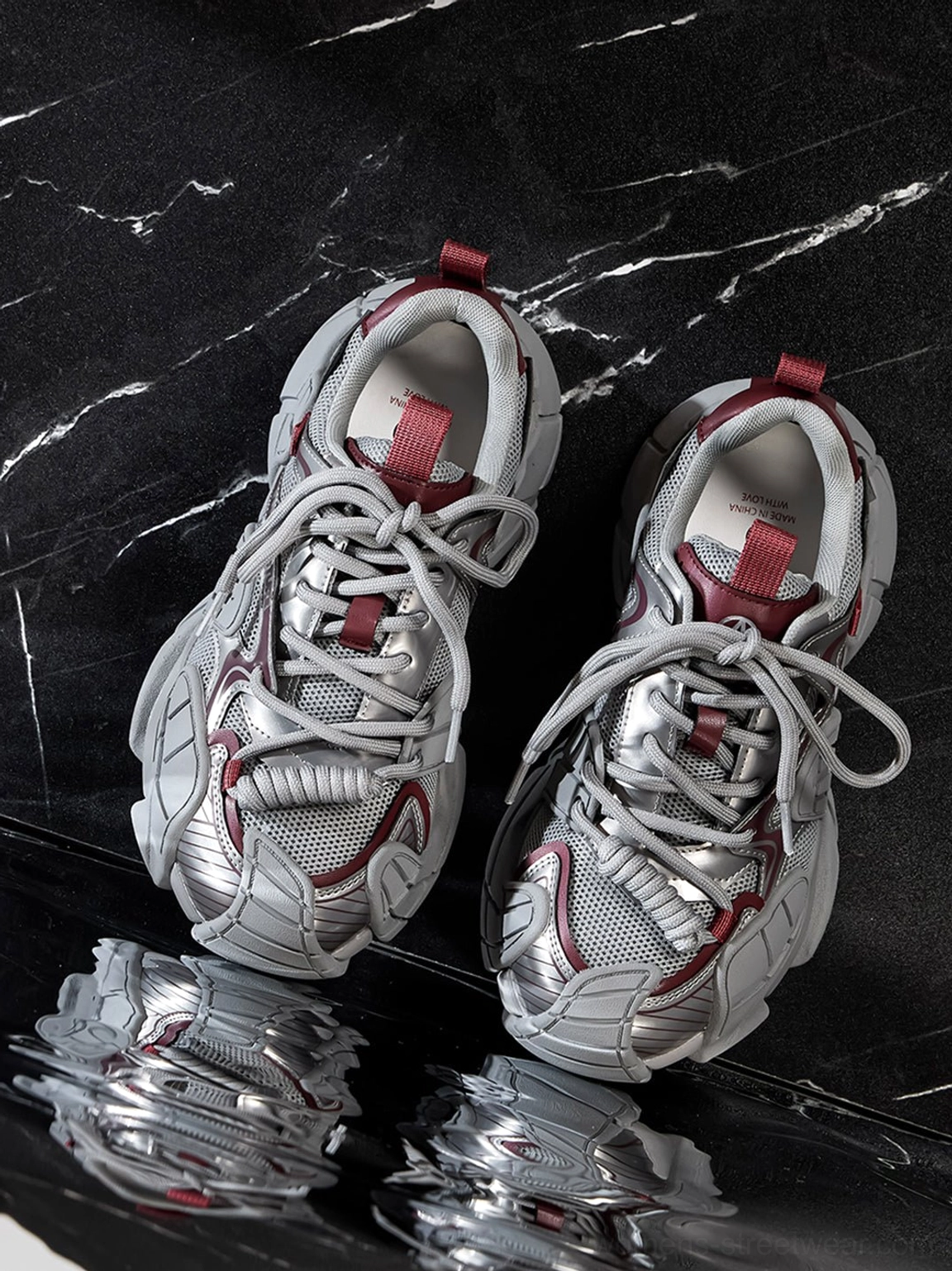Silver cage panel chunky platform sneakers detailed metallic side cage construction