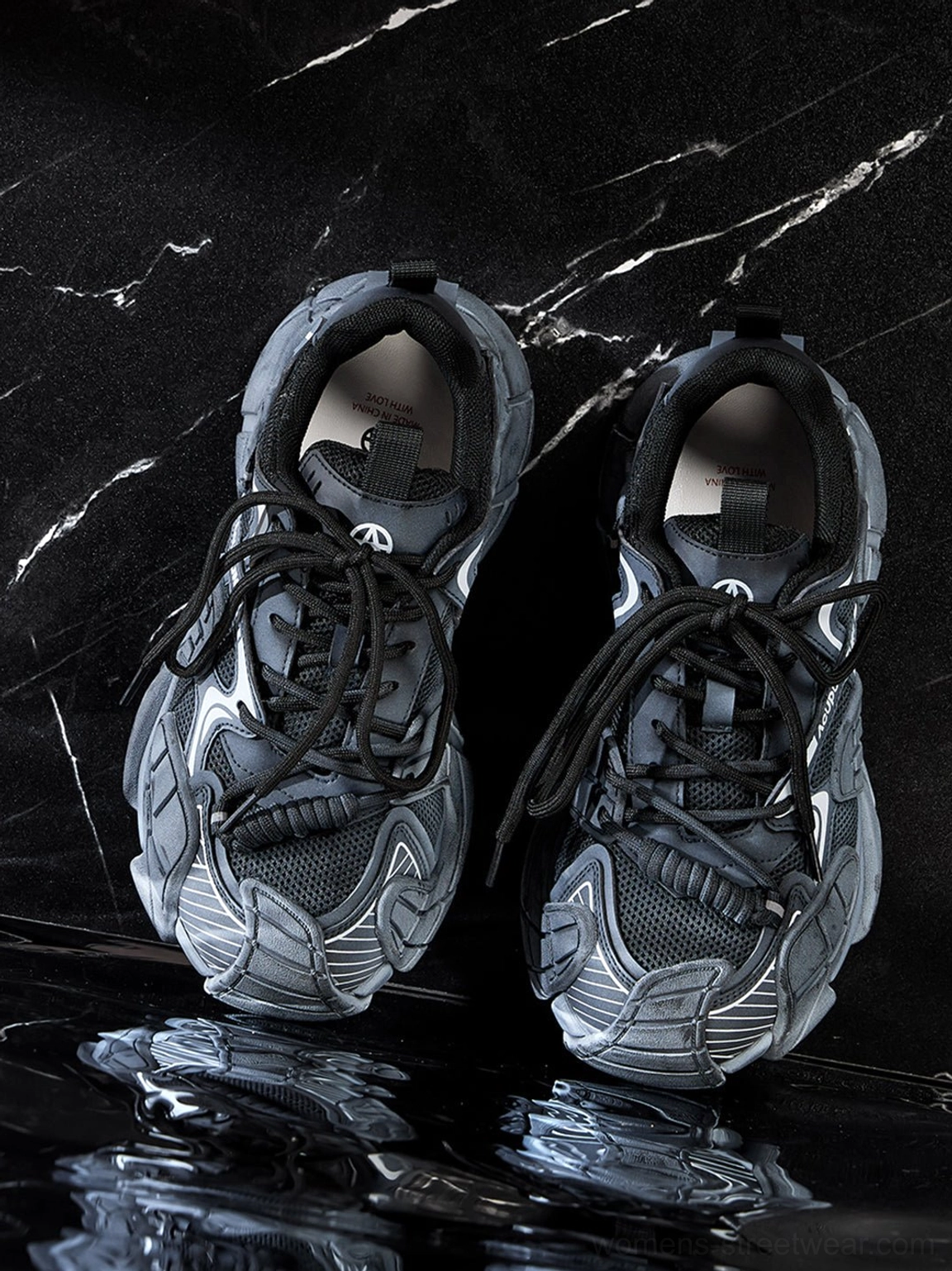 Top view of silver cage panel chunky platform sneaker pair with lace up mesh construction