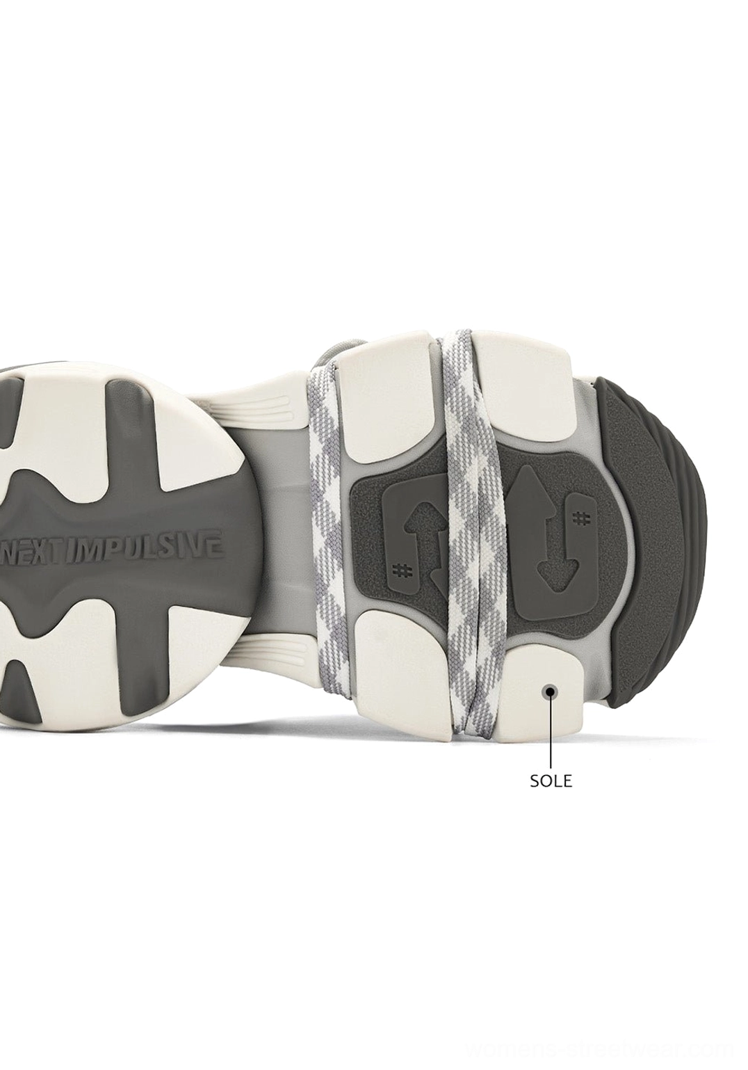 Overhead view of silver chunky platform sneaker outsole with textured anti slip tread and technical sole details