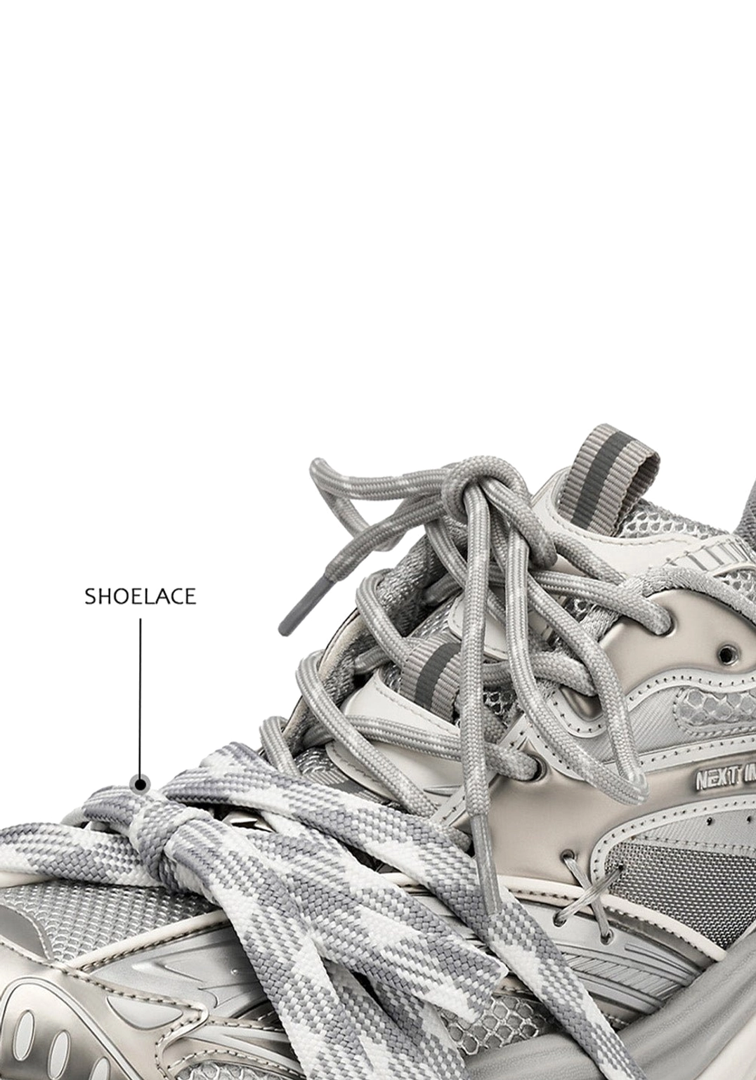Close up of silver chunky platform sneaker upper with camouflage patterned shoelaces mesh fabric and labeled lace detail