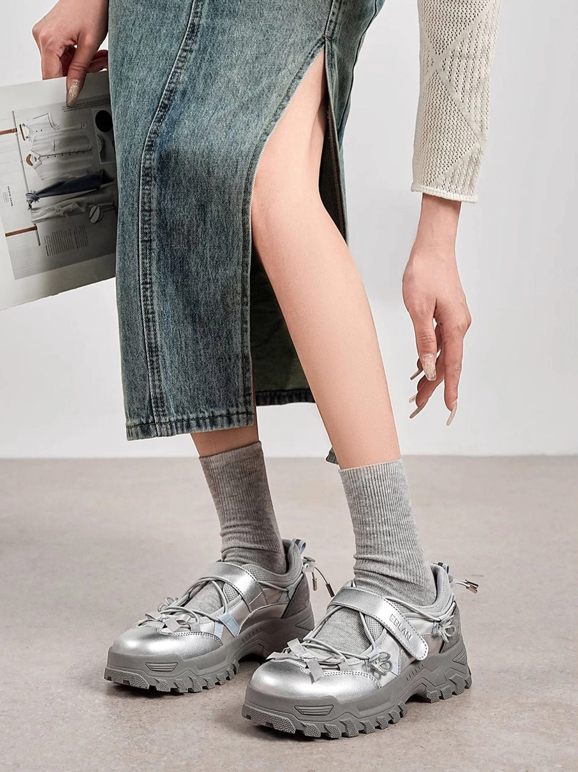 Silver gray Mary Jane platform sneakers styled with a denim skirt and knit top for a casual Korean fashion outfit